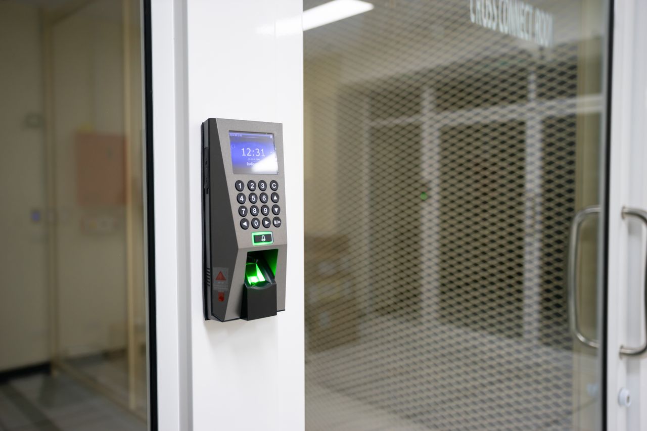 Home A modern fingerprint scanner for secure access control in an office environment.